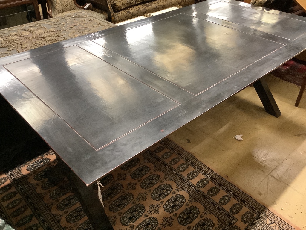 A contemporary ebonised dining table, width 200cm depth 100cm height 77cm
